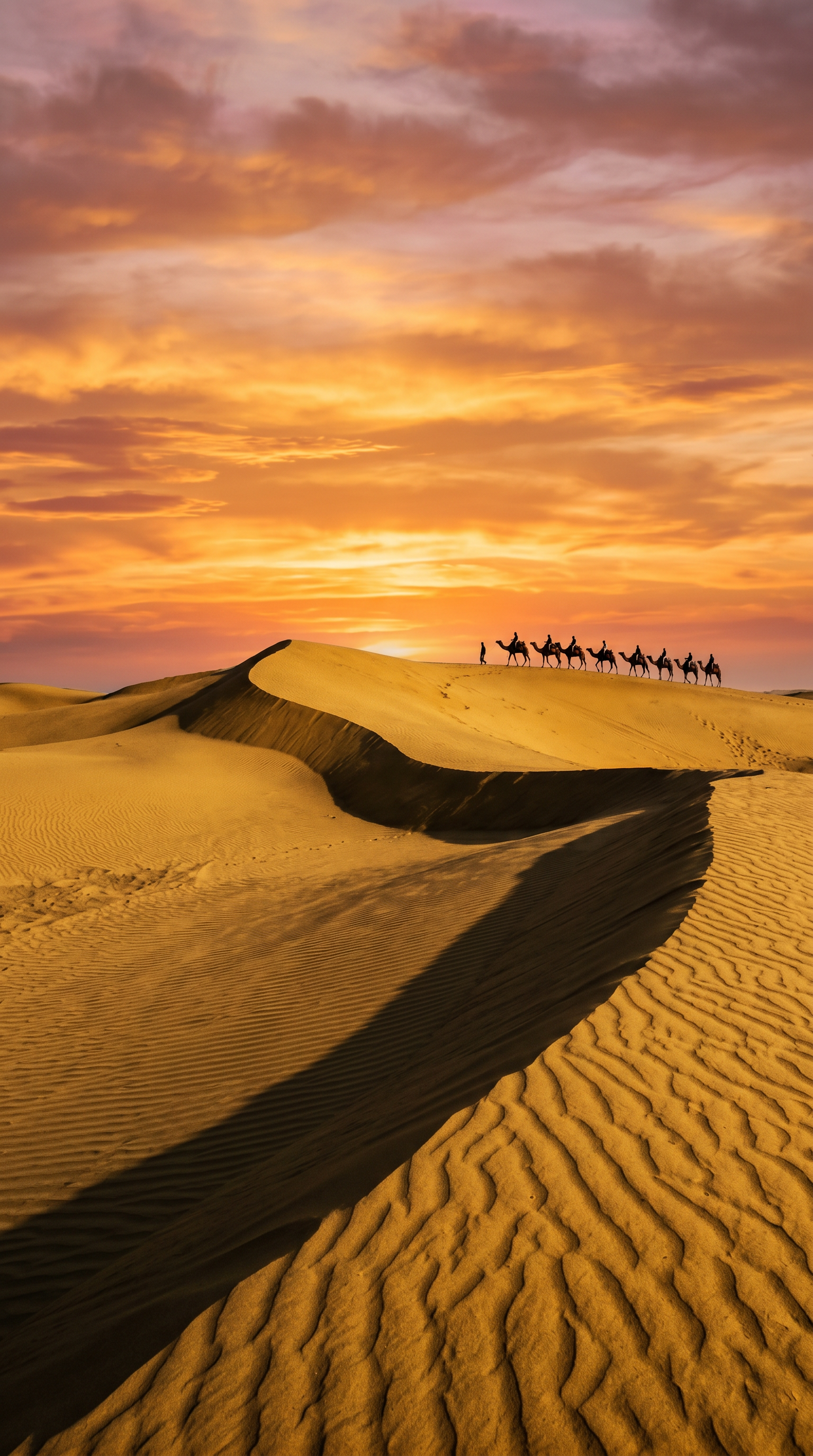 Golden sand dunes and a camel caravan near Jaisalmer